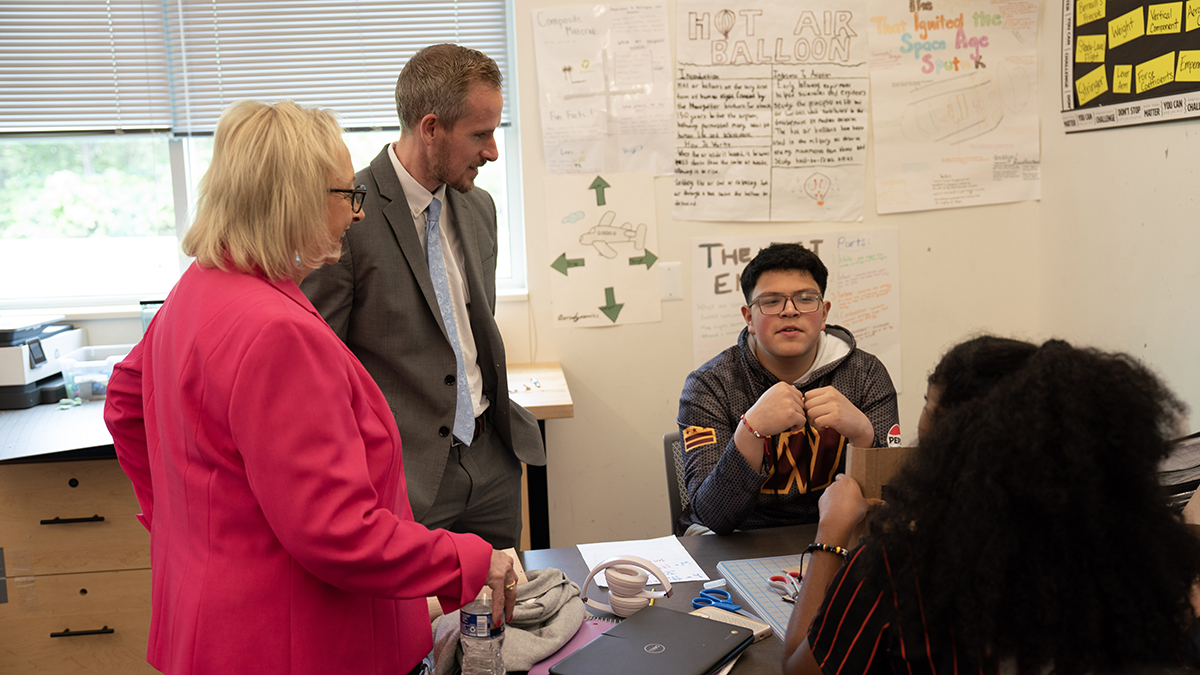 Dr. Wright speaking with high school students