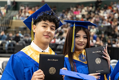 High-Point-High-School-graduates-holding-diplomas