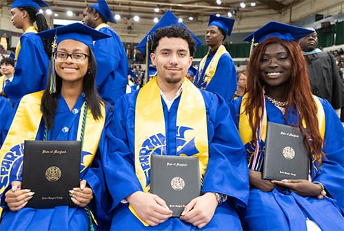 Laurel-HS-graduates-holding-diplomas