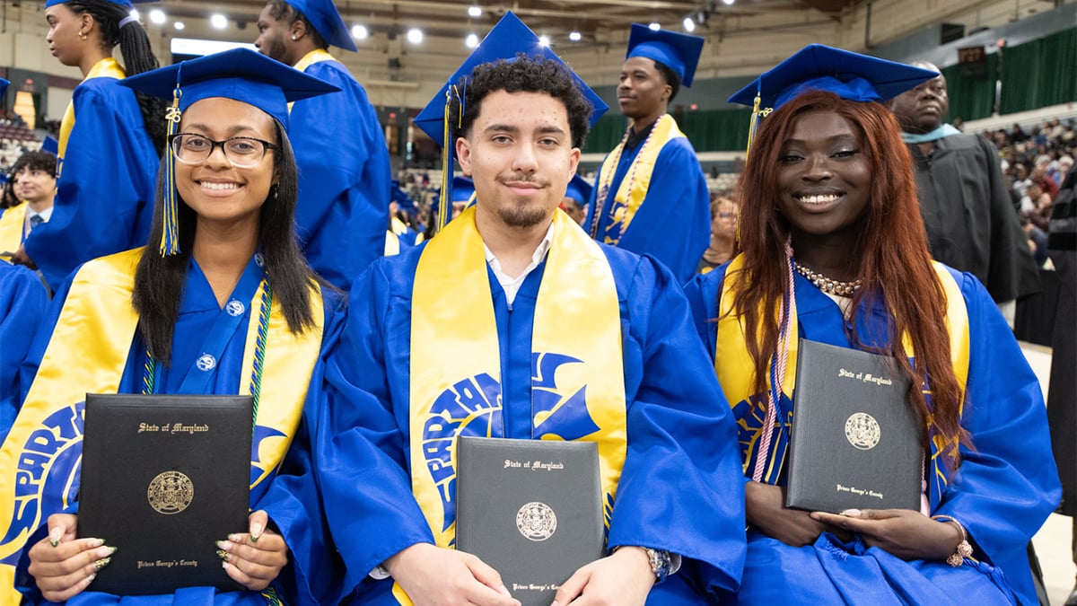 Laurel-HS-graduates-holding-diplomas