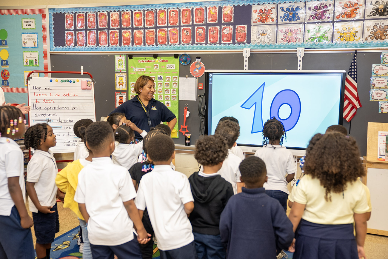 teacher-leading-elementary-students-in-class