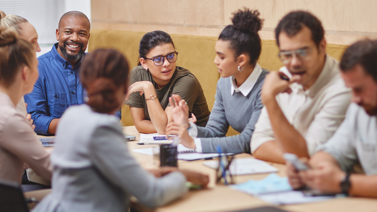 group-of-adults-talking-at-meeting
