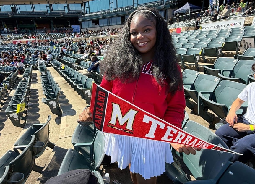 graduate-holding-University-of-Maryland-Terrapins-pennant