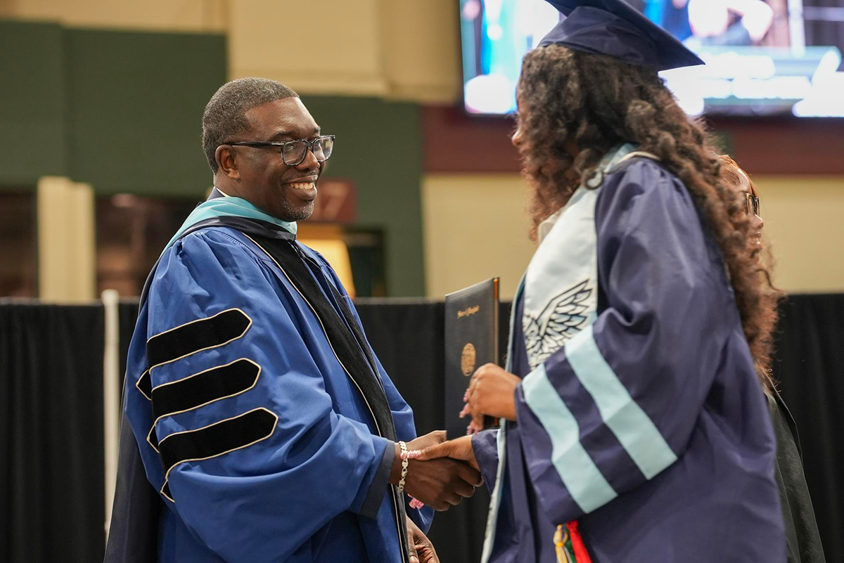 Dr-Shawn-Joseph-shaking-graduates-hand