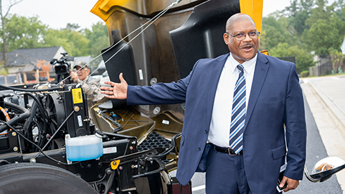 Man showing Bus Engine.png