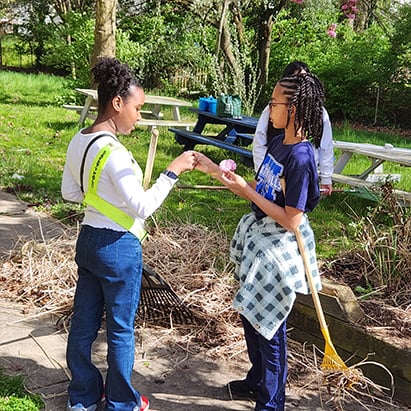 PD-students-cleaning-school-grounds-area.jpg