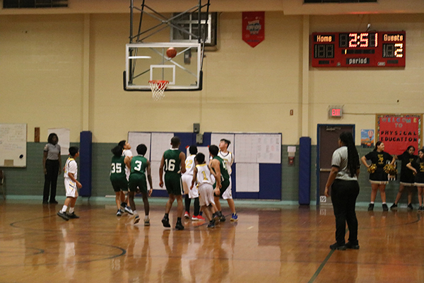 blms-boys-basketball-game-players-under-basket