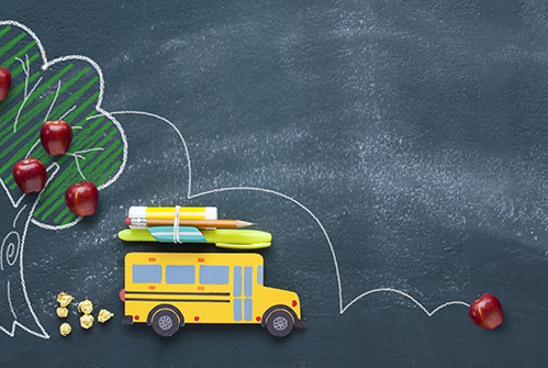 back-to-school-yellow-school-bus-tree-with-apples-on-chalkboard-background