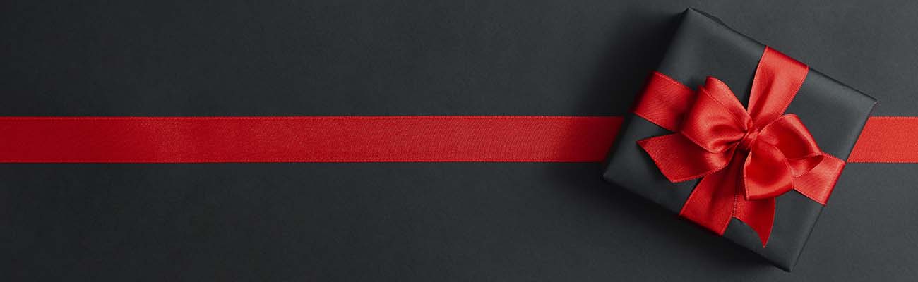H-background-black-gift-box-with-red-ribbon-on-black-background-banner.jpg