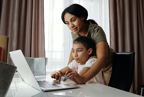 M-parent-helping-child-on-computer.jpg